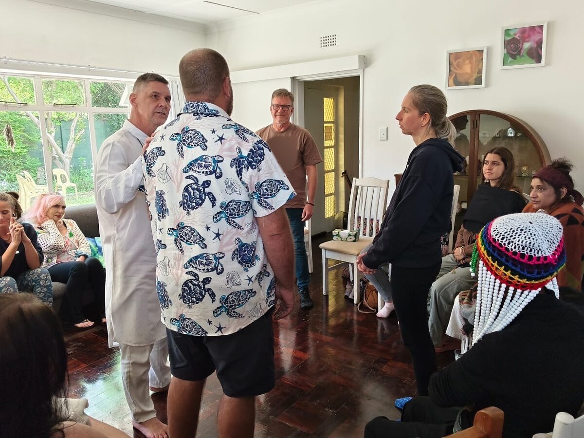 Gary guiding a group Family Constellation session in Johannesburg, with participants standing in the circle as representatives